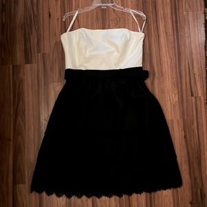 White House black market, white and black ruffled dress with bow belt.